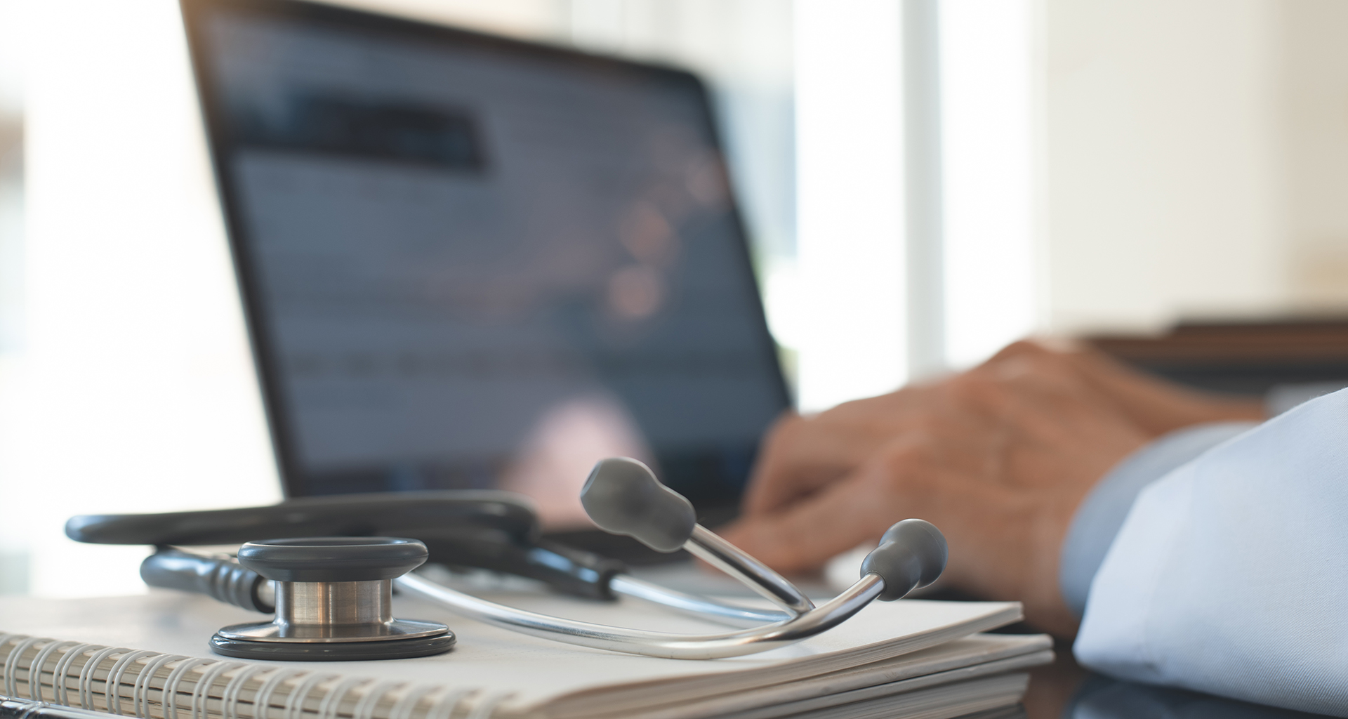 Doctor working on laptop computer